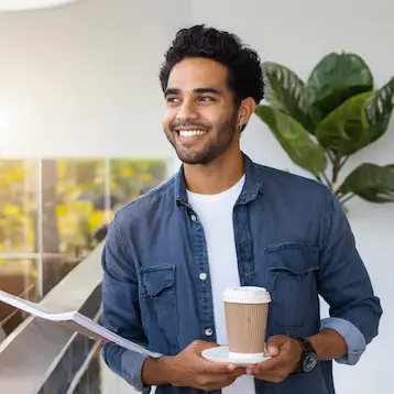 Gallery image of a person with coffee