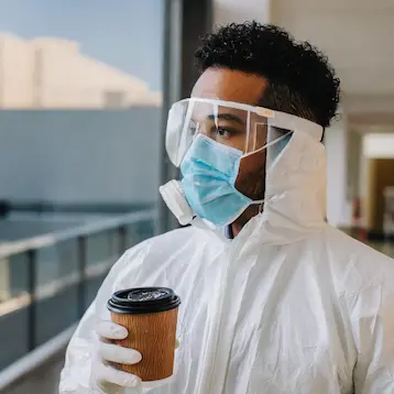 Gallery image of a person with coffee